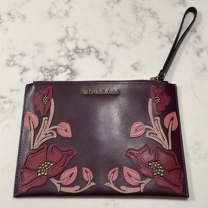 Michael Kors Zip Leather Clutch. New with tags. Nouveau floral/mulbry